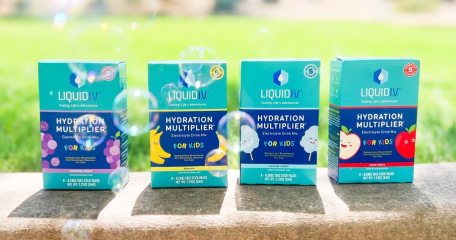 four boxes of Liquid I.V. Hydration Multiplier for Kids on curb with bubbles
