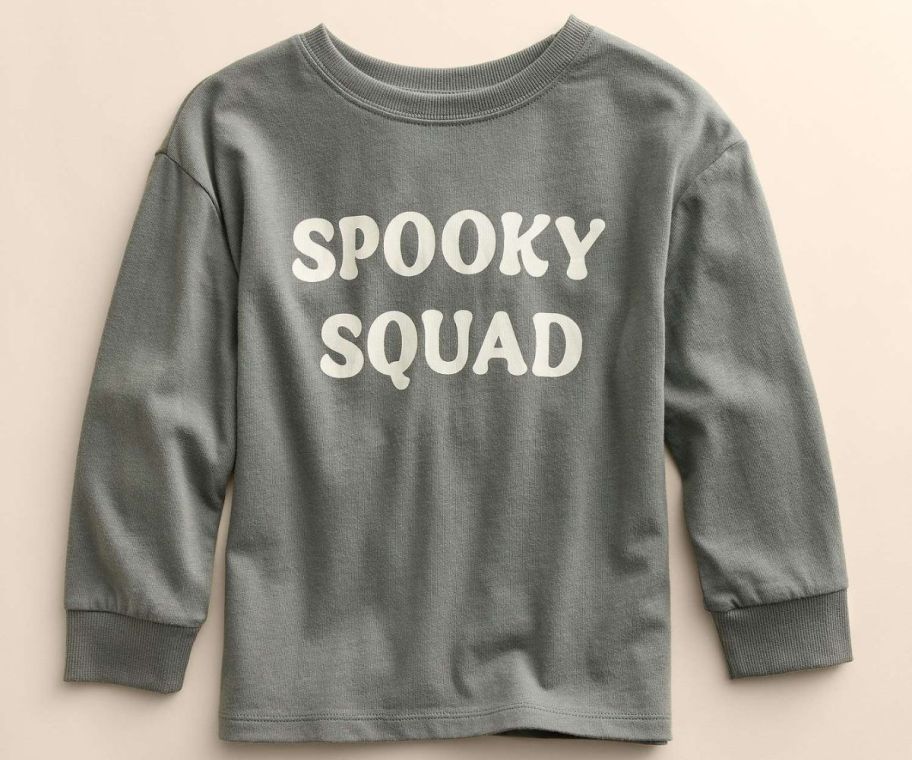 a kids long sleeve graphic tee with the words spooky squad across the front