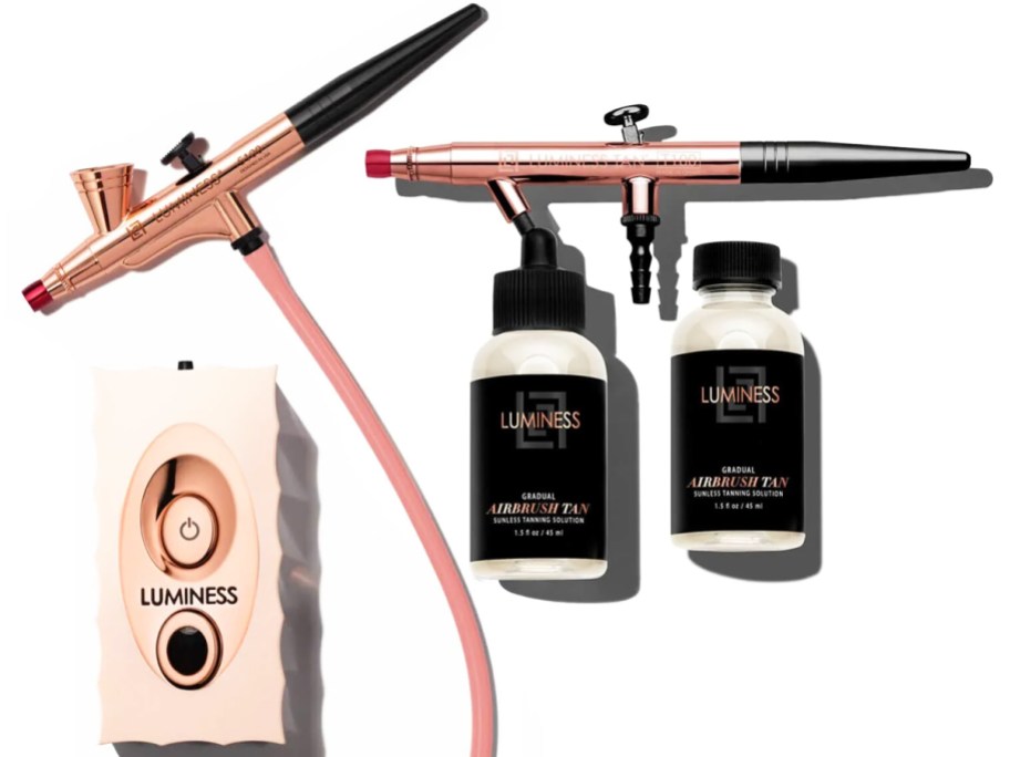 airbrush machine and bottles of sunless tanner