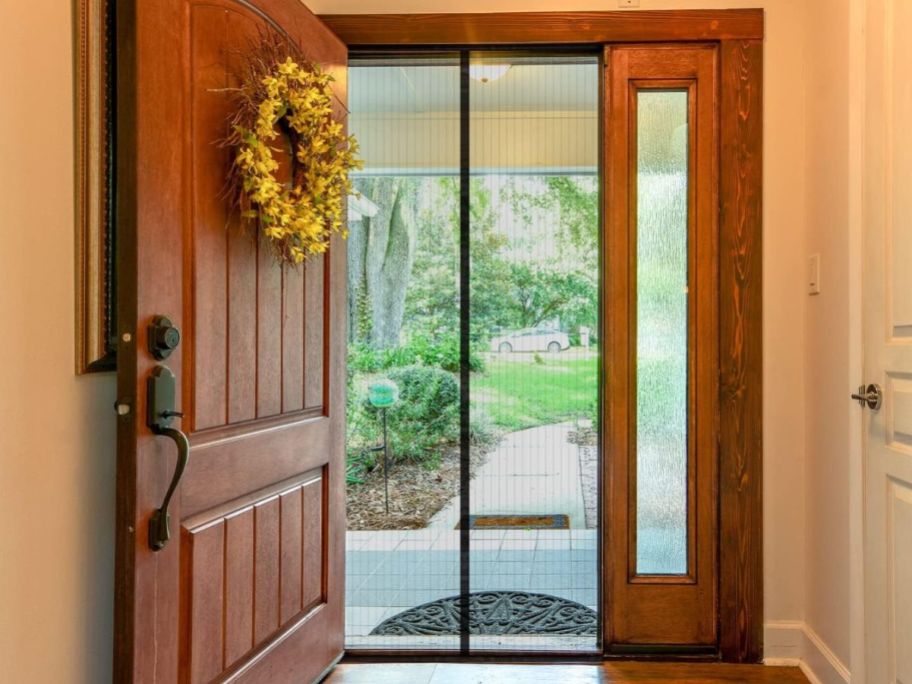 A front door of a home with a Magnetic Screen door