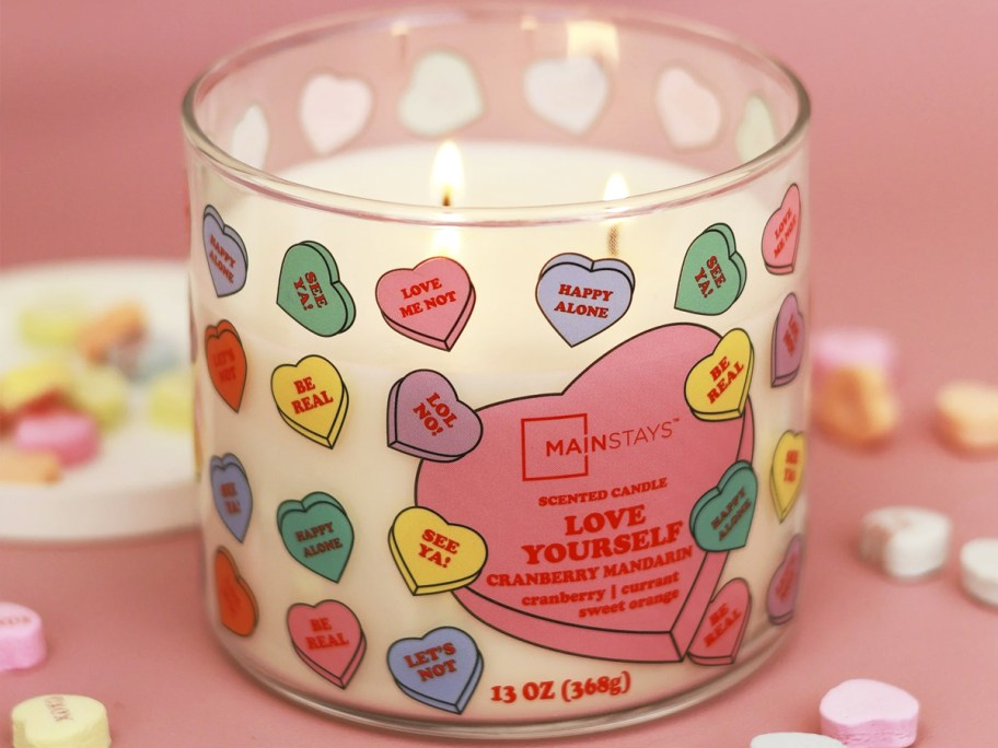 valentine candy heart printed candle surrounded by candy hearts