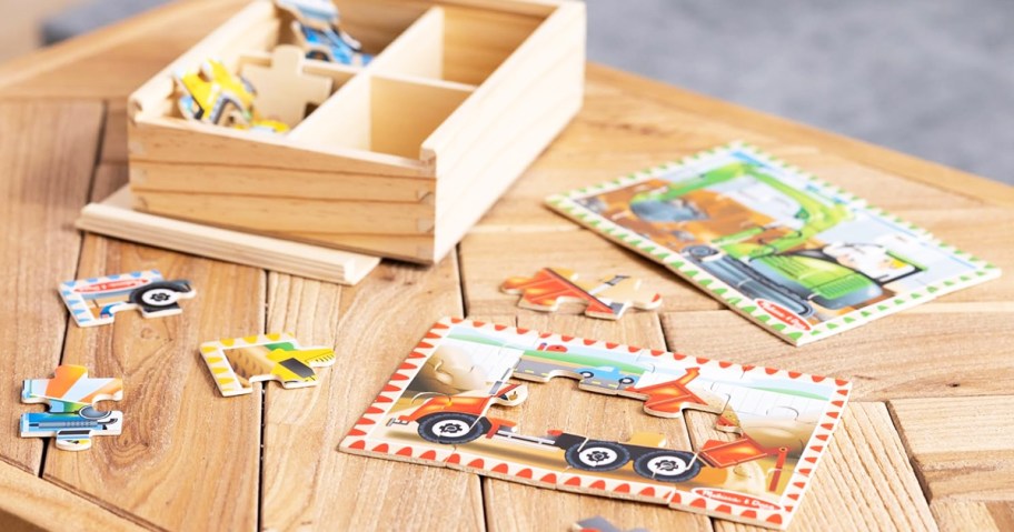 construction vehicle wooden puzzles and storage box on table