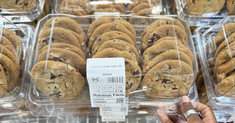 hand holding a pack of chocolate chip cookies at sam's club