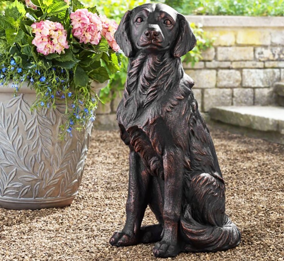 Golden Retriever Dog Statue near potted plant
