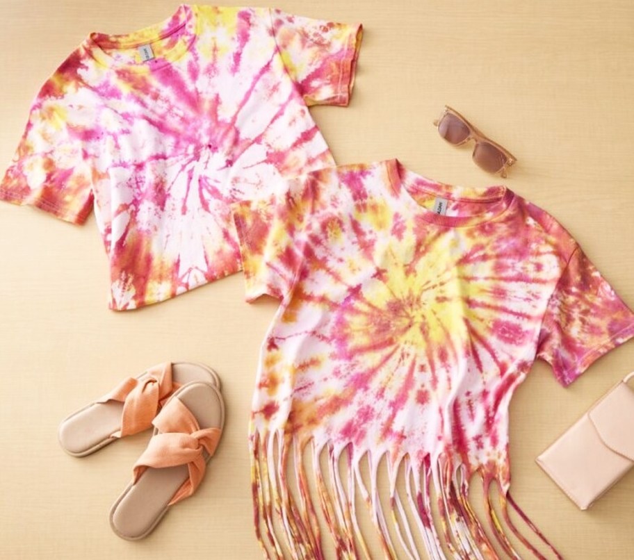 two pink, yellow, and orange tie dye shirts