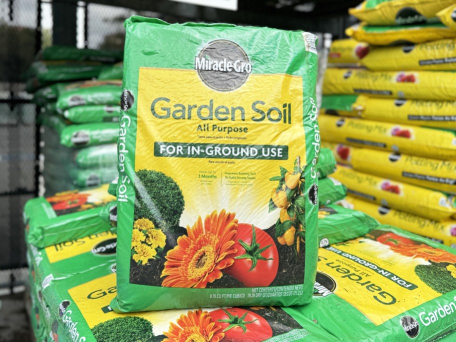 green and yellow bag of Miracle-Gro soil standing up