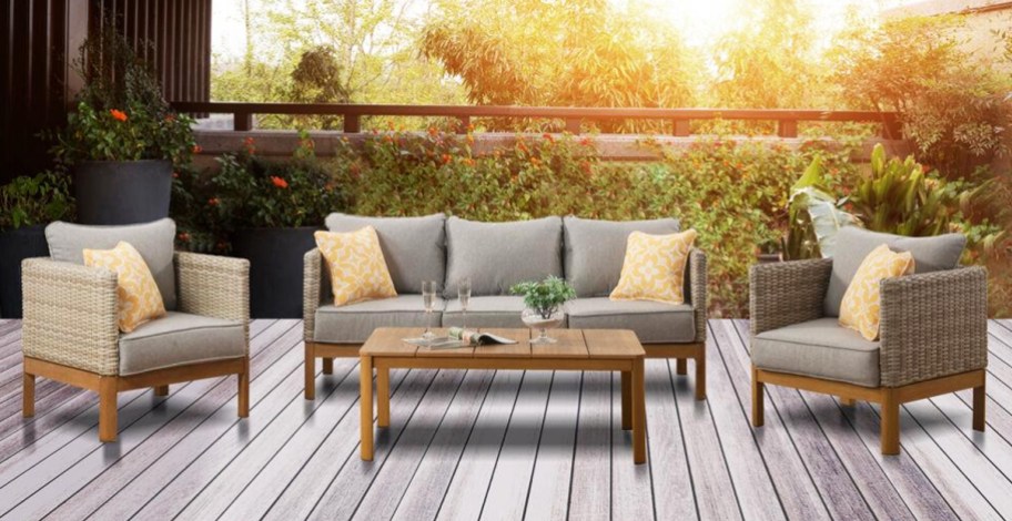 patio seating set with loveseat, two chairs, and coffee table