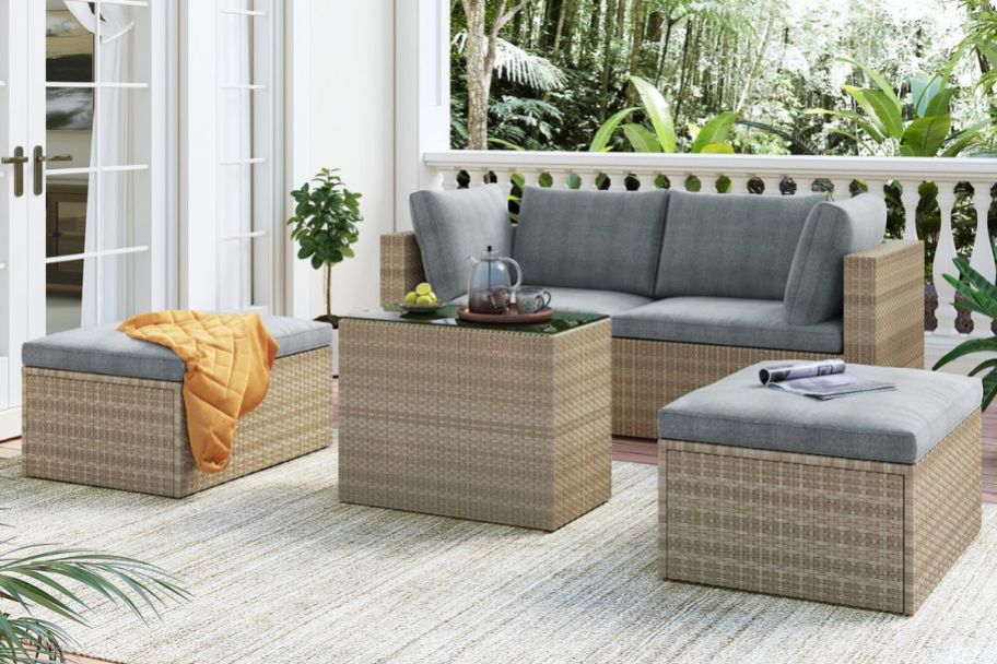 4 piece patio set with gray cushions on a porch