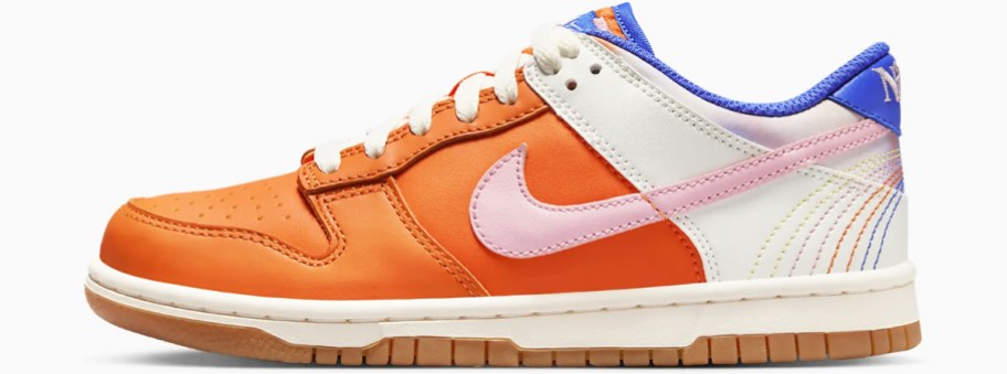 nike orange and white kids shoes stock image