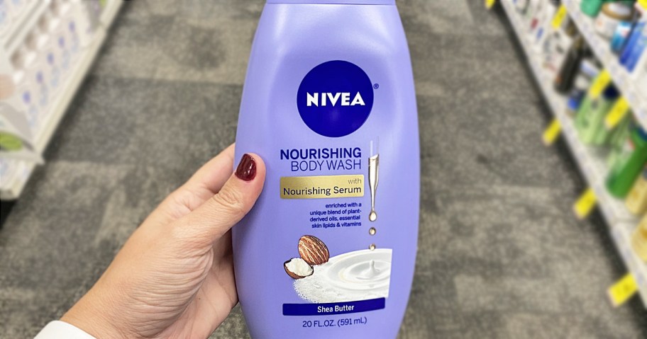 hand holding bottle of nivea body wash