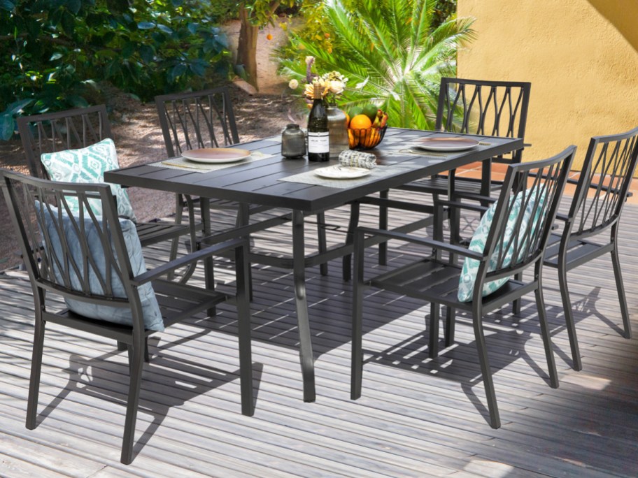 black patio dining set with table and 6 chairs