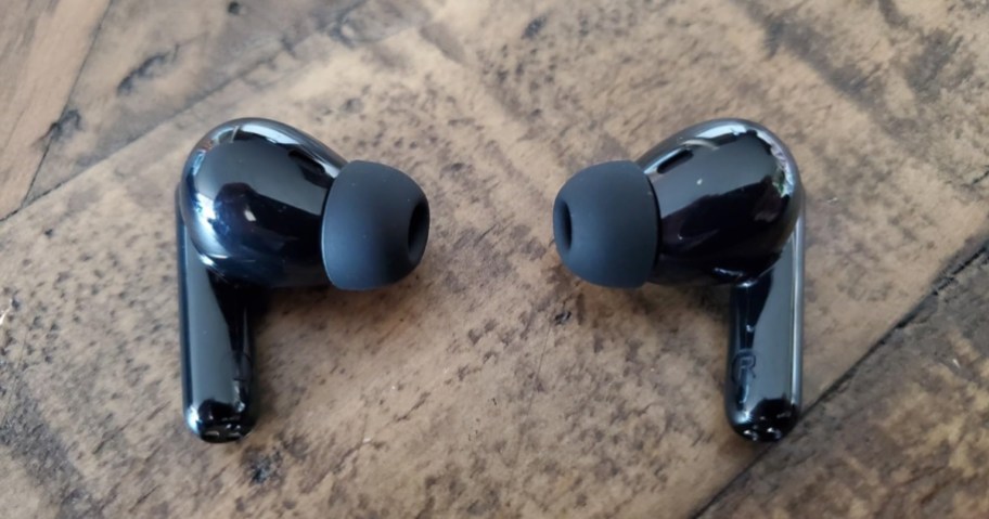 black pair of wireless in ear headphones