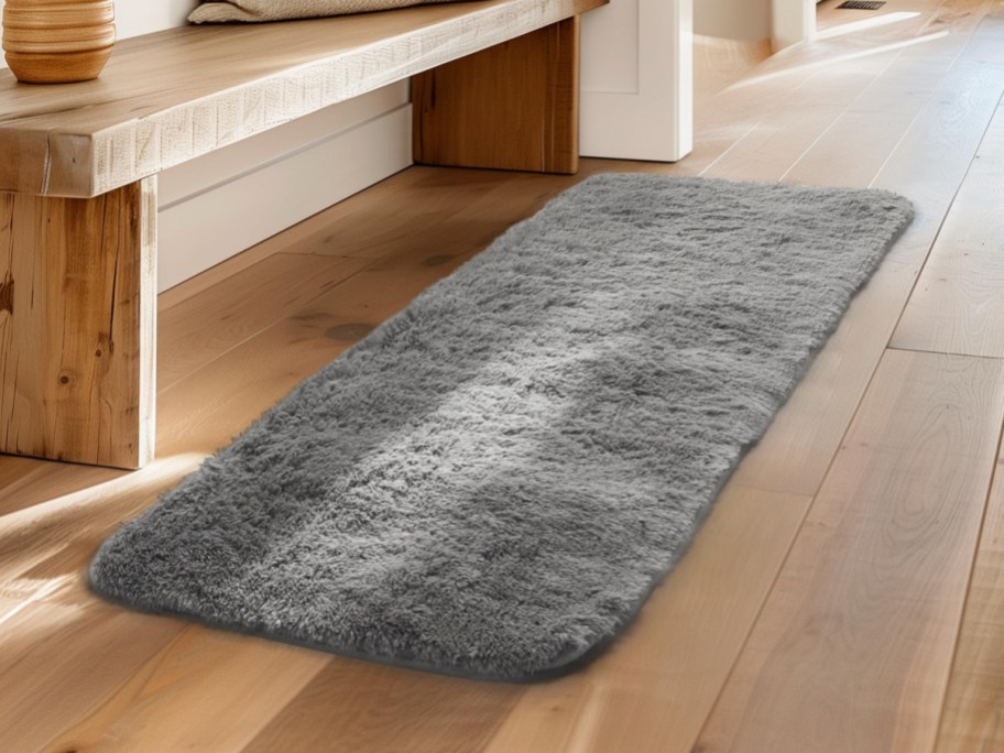 gray shag runner rug on wood floor