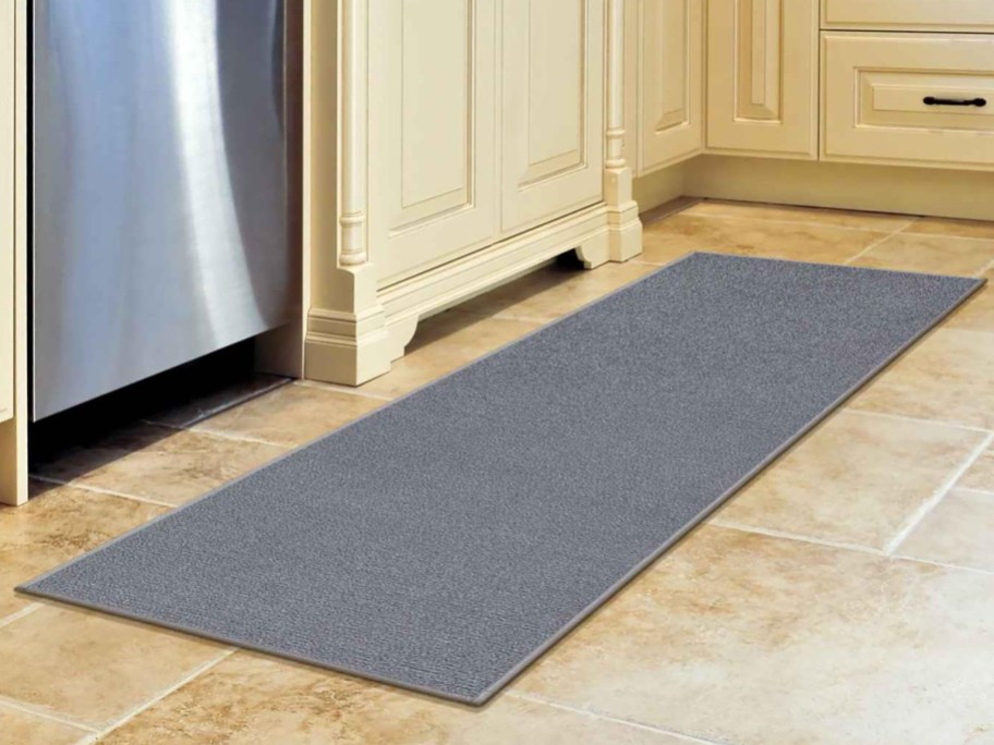 gray runner on tile kitchen floor