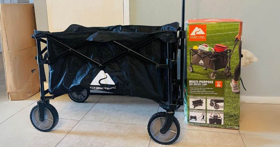 Ozark Trail Camping Utility Wagon Cart in hallway next to box