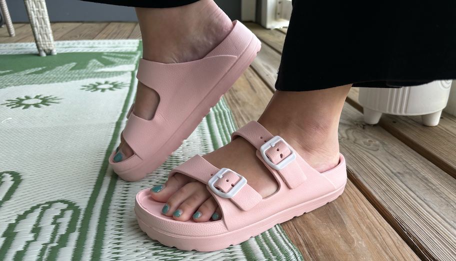 close up of feet with light pink platform slides