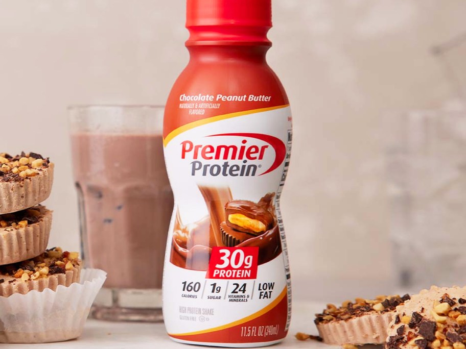 bottle of Premier Protein on counter near chocolate treats