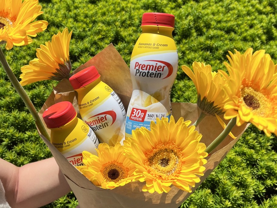 Premier Protein shakes in in bouquet of yellow flowers