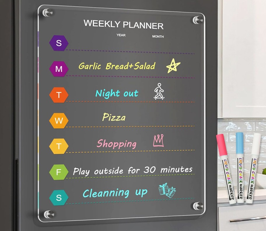 weekly planner on black fridge