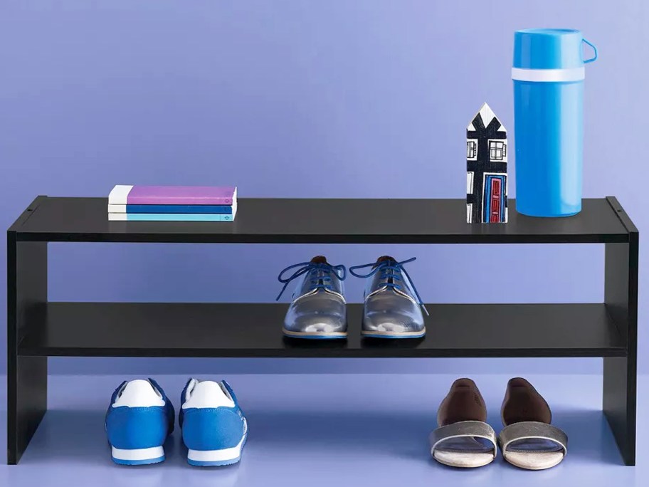 black 2-tier shelf with shoes on and under it