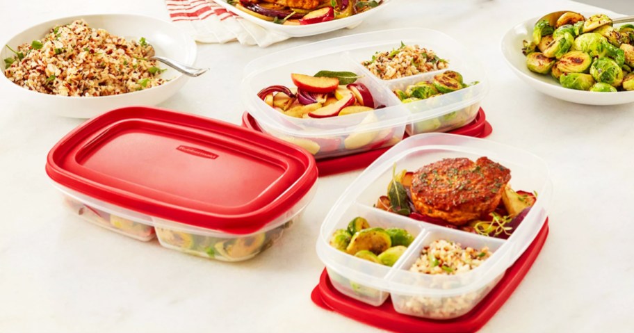 rubbermaid divided food containers with red lids on a kitchen table, person putting food into 1 of them