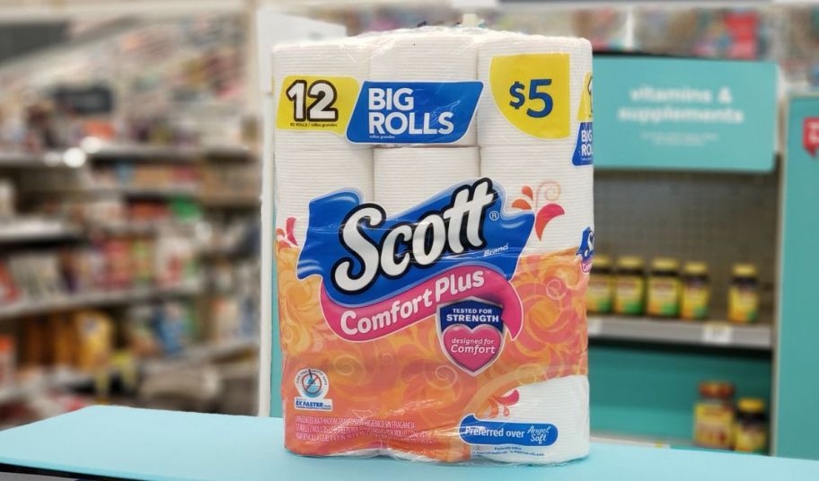 a 12 pack Scott comfort plus Tissue on a counter in a walgreens store