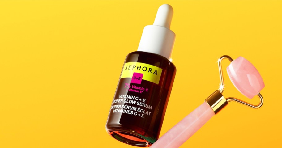 brown bottle of Sephora Collection Super Glow Serum with pink jade roller