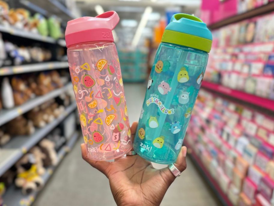 A hand holding two Squishmallows Water Bottles