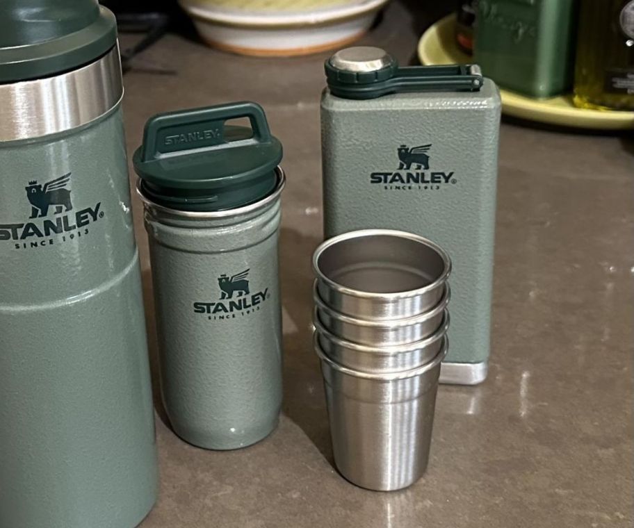 stanley shot glass set and flask on a kitchen counter