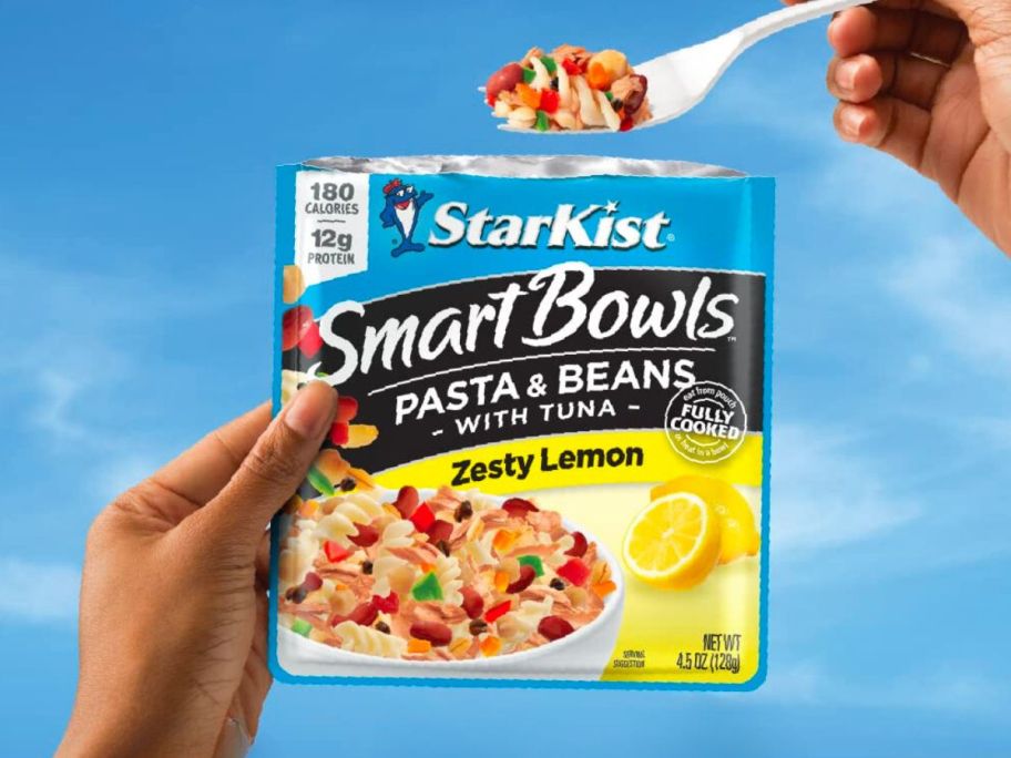 A person eating a StarKist Smart Bowls Pasta and Beans Zesty Lemon Tuna