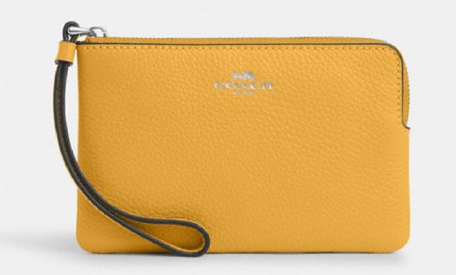 Stock image of Coach Corner Zip Wristlet in yellow