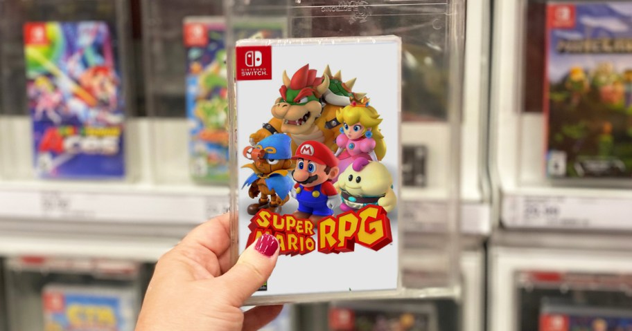 hand holding up Super Mario RPG Nintendo Switch game in store