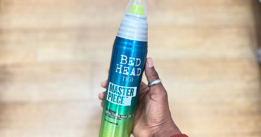 hand holding a can of TIGI Bed Head Master Piece Hairspray