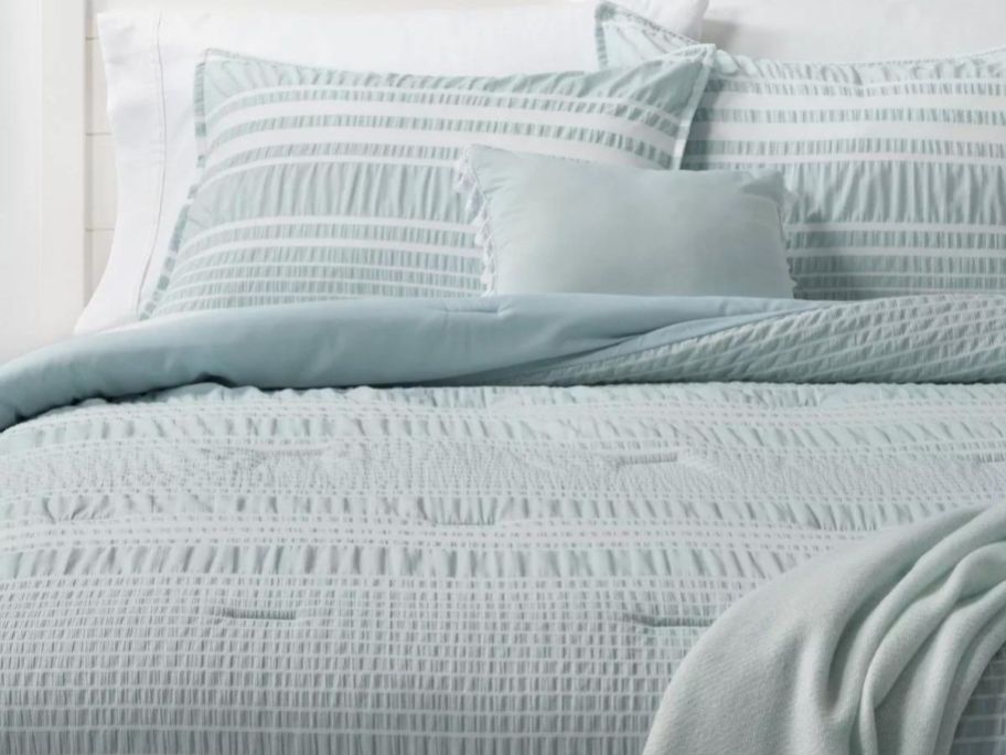 Stock image of Threshold Seersucker Stripe Comforter Set