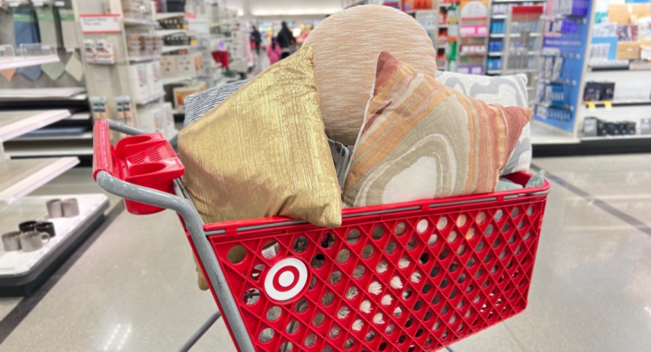 Target cart filled with throw pillows in multiple colors and patterns