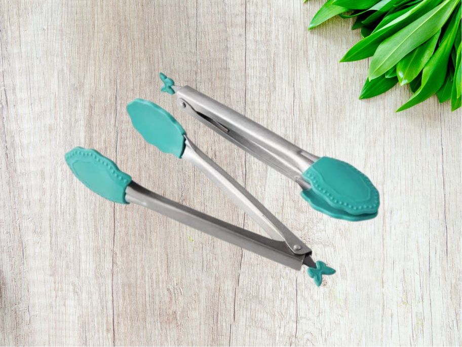 The Pioneer Woman 2-Piece Stainless Steel Mini Serving Tongs w/ Silicone Tips on counter