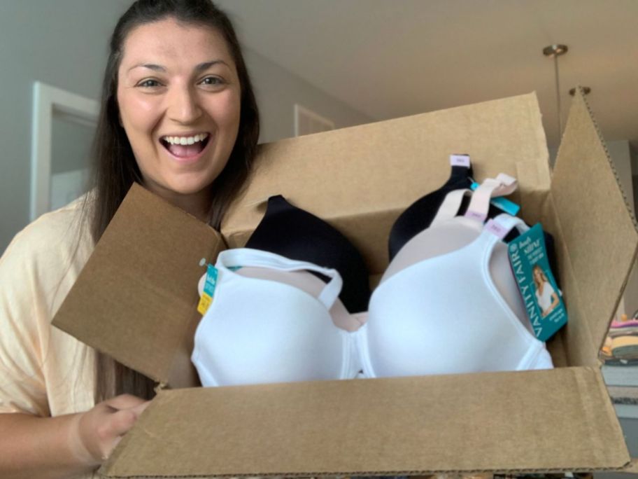 Woman holding a box of brand new Vanity Fair bras