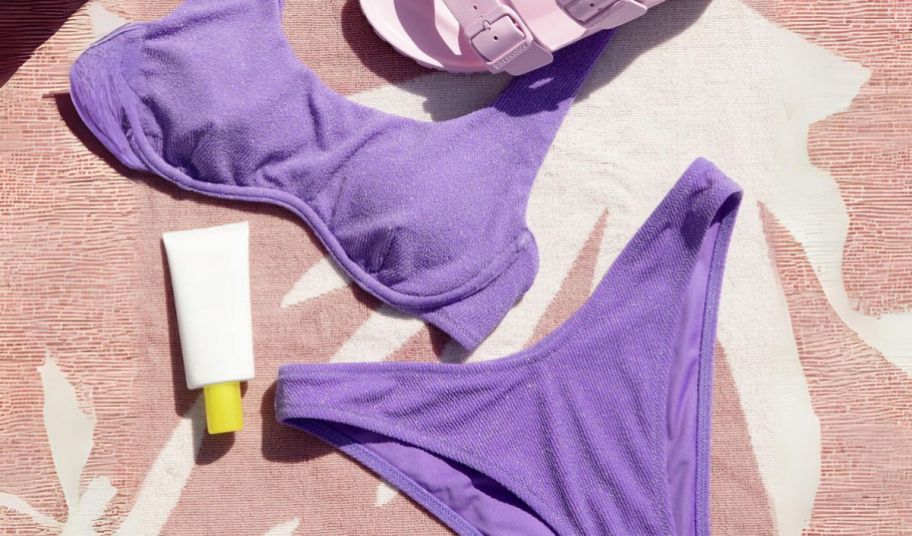 a purple victorias secret swim top and bikini bottom