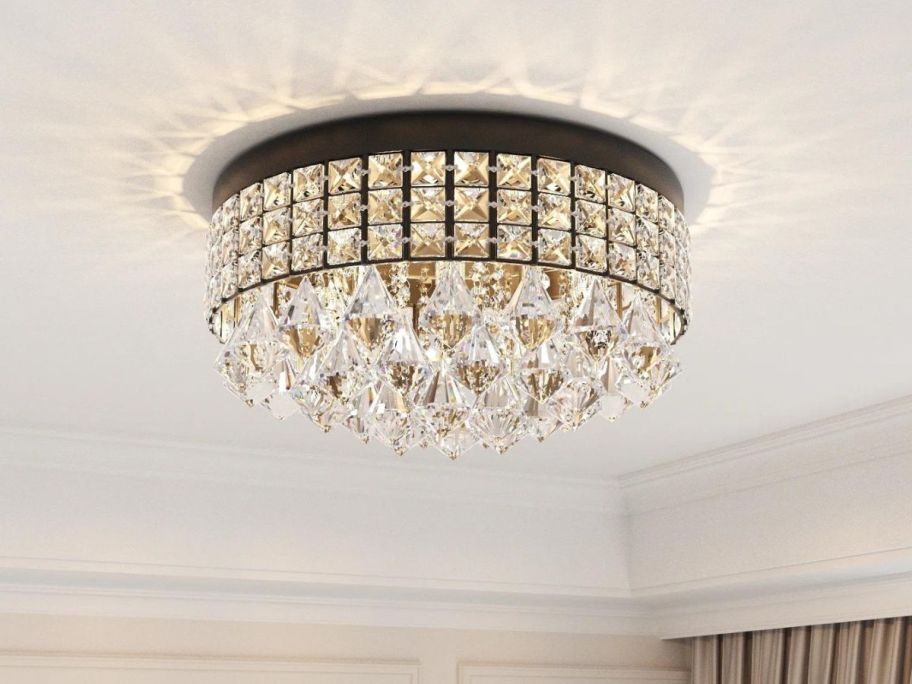 A ceiling with a Willa Arlo Interiors Theodora Flush Mount Light w/ Crystal Accents on it