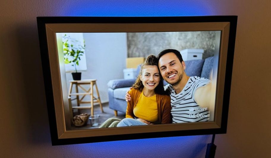 a digital picture frame with an image of a dad and small child
