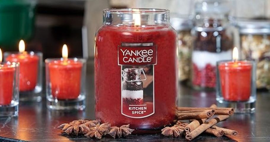 Yankee Candle Kitchen Spice 22oz Large Jar Candle sitting amongst other smaller candles and spices