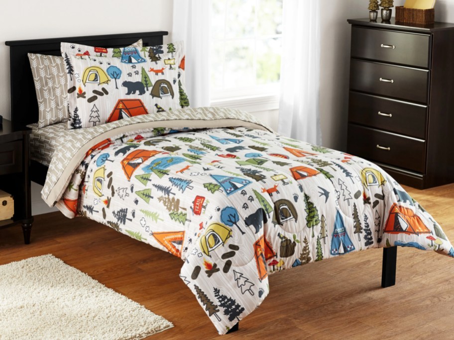camping print comforter set on bed