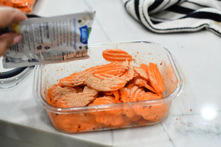 adding a little ranch fiesta seasoning to raw carrot chips