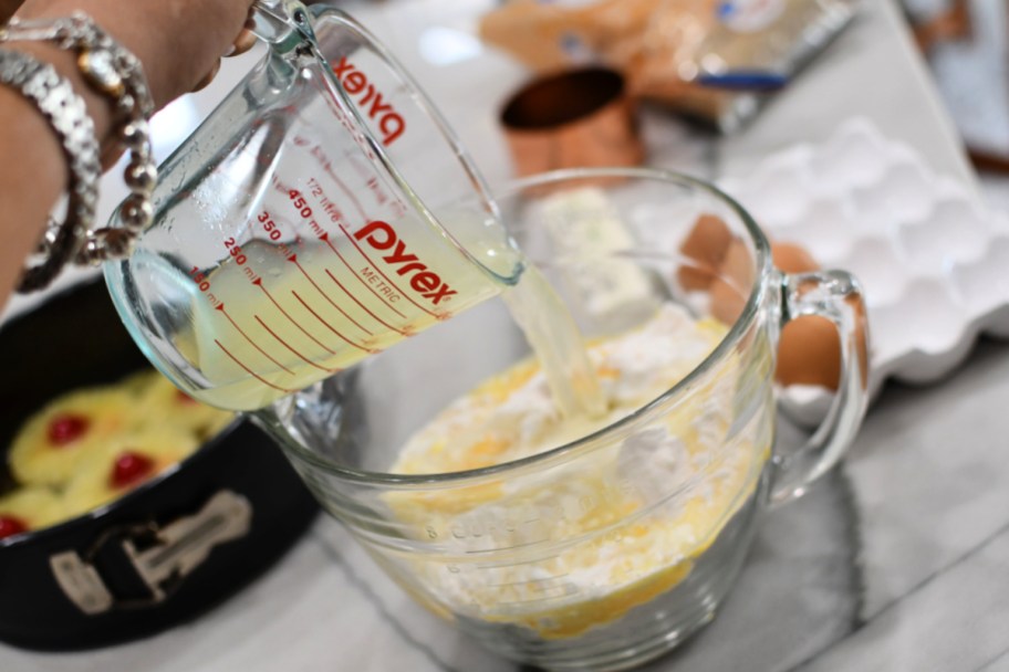 adding pineapple to the cake mix