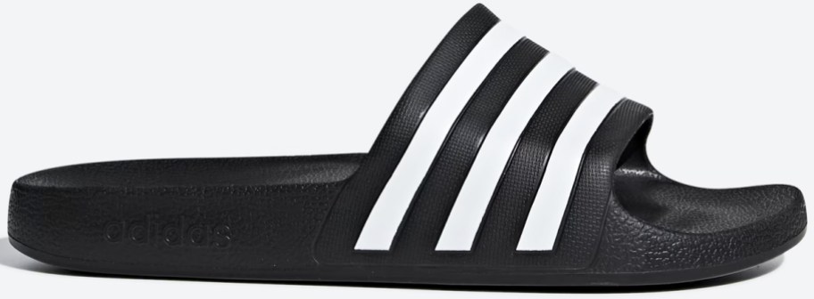 black adidas slide with white stripes