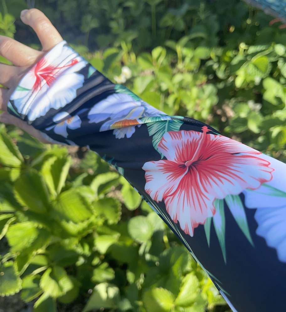 close up of arm with tropical gardening sleeve on top