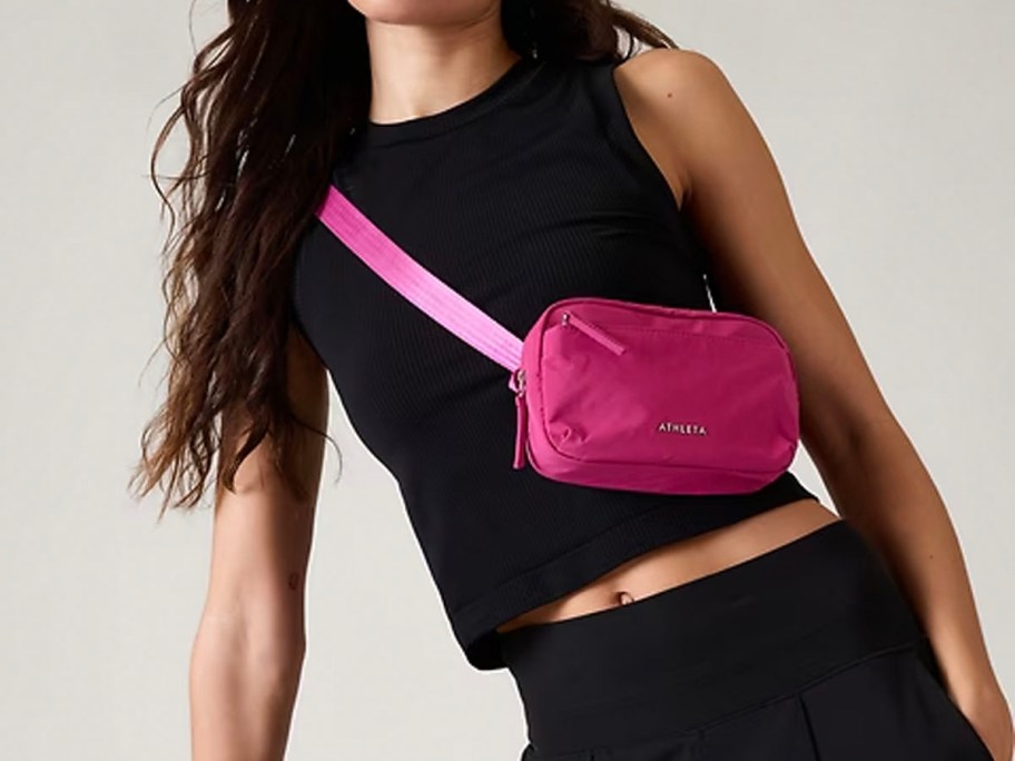 woman wearing hot pink belt bag