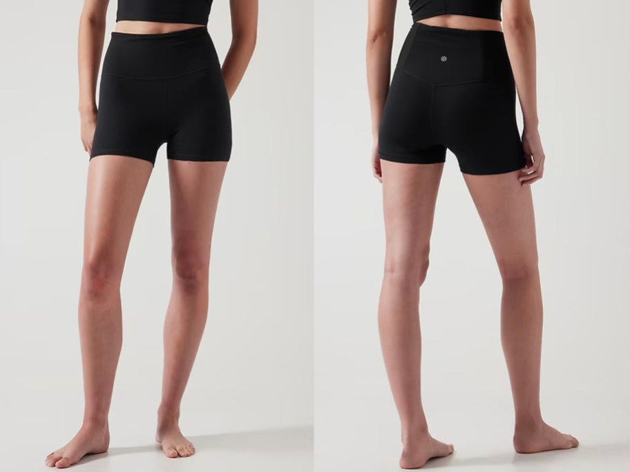 woman front and back image wearing black shorts