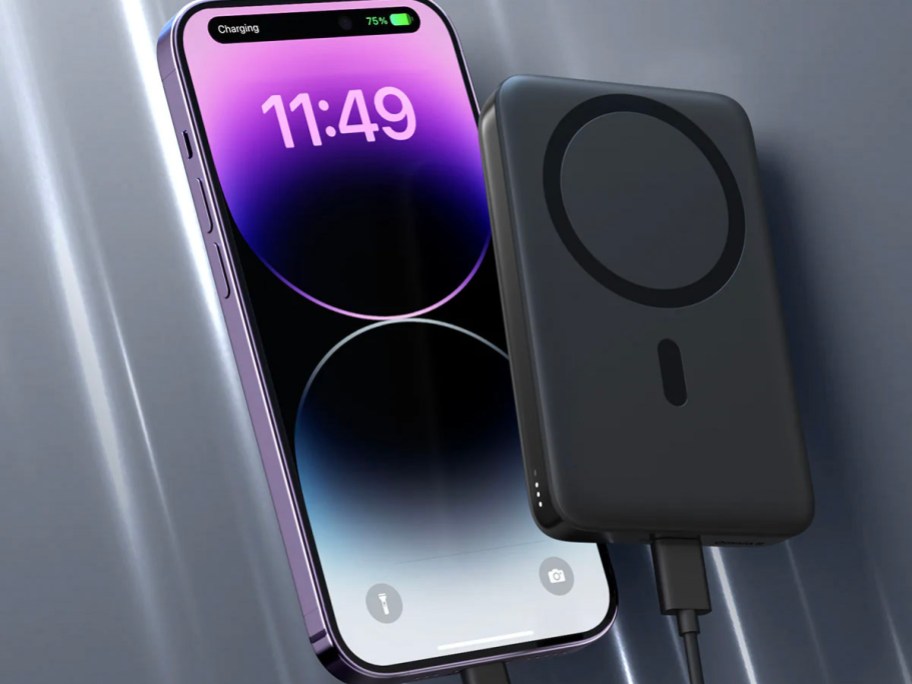 aukey black powerbank attached to phone