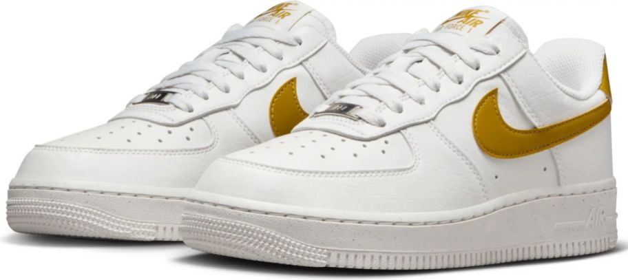 a nike air force 1 sneaker in white and bronze brown